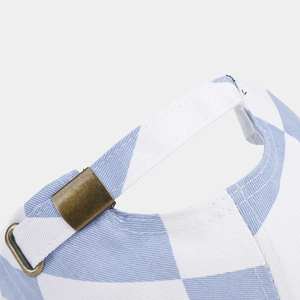 Detail of blue and white checkered cotton baseball cap with vintage bronze metal buckle