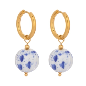 Detail of vintage enamel earrings featuring gold hoops and blue speckled ceramic flower beads