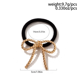 Close-up showing the 5cm golden twisted bow decoration and black elastic hair tie dimensions