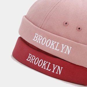 Pink and burgundy canvas Miki hats with Brooklyn embroidery and side ventilation holes