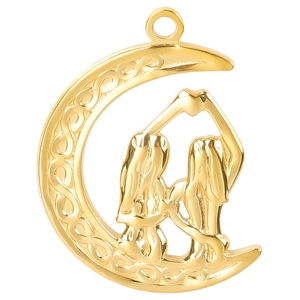 Close-up of golden crescent moon pendant with Celtic knots and Gemini twins figures