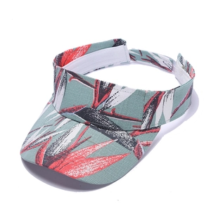 Detail of tropical leaf print sun visor with breathable sweatband and adjustable strap