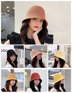 Detail of crochet weave pattern on various colors of bucket hats for women