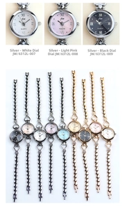 Detail view of stylish small quartz watches for women with beaded chain metal bracelets