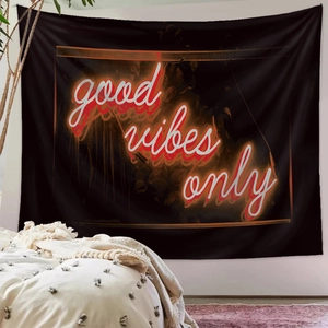 Detailed view of Good Vibes Only neon wall tapestry in a cozy modern bedroom setup