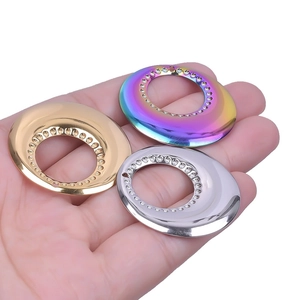 Polished 18k gold, silver, and rainbow stainless steel rings with dotted edge design