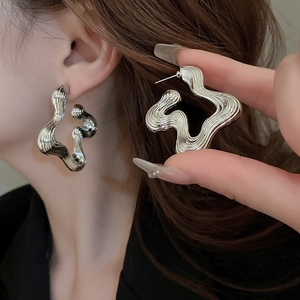 Chic silver irregular wavy geometric hoop earrings with hollow industrial texture design