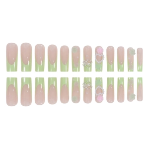 Long green French tip press-on nails with 3D pearls, bows, and flower charms