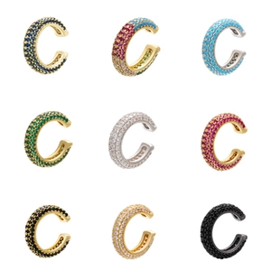 Macro view of C-shaped ear cuffs with multi-colored micro-pave cubic zirconia crystals