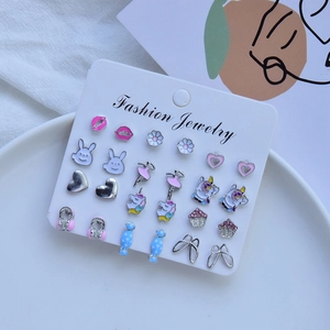 Set of 15 pairs colorful animal and geometric stud earrings on a white display card
