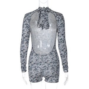 Detail view of the sexy backless design and tie-up halter neck on the floral bodysuit