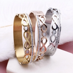 Three rows of infinity titanium steel bracelets with double row diamonds and shell inlay