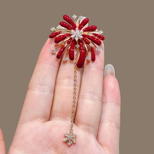Elegant red enamel firework brooch with gold tassel and sparkling zircon snowflake pendant