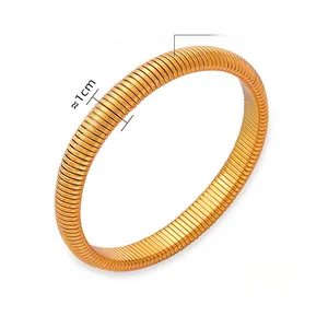 Detailed view of wide 1cm golden titanium steel spring bracelet with size measurements
