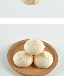 Detailed macro view of three lifelike PVC steamed buns on a wooden tray food model