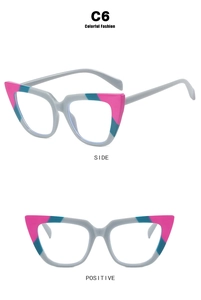 Detail view of pink and teal color-blocking on cat-eye frames with stylish geometric accents