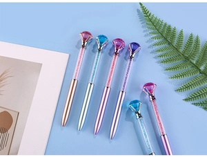 Macro shot of 6 crystal diamond ballpoint pens with liquid glitter and metallic finish