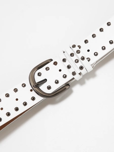 Detail showing white leather punk belt with triple rows of metal studs and D-ring buckle