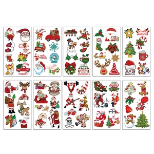 Set of 10 waterproof Christmas tattoos featuring Santa, reindeer and trees in grid layout