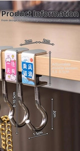 Detail of adjustable metal desk hook with rabbit design clipped to a wooden tabletop