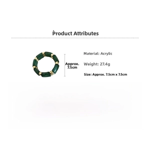 Detailed view of dark green acrylic beaded bracelet with gold spacers and glitter finish