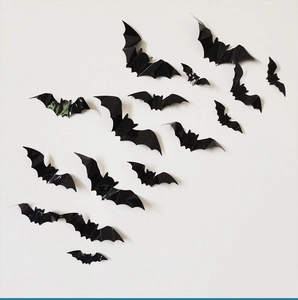 3D black PVC bat wall stickers in various sizes creating a swarm effect for Halloween