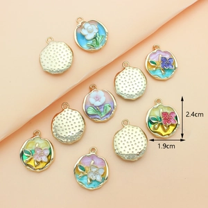 Detail view of colorful floral oil-dripping charms with dimensions of 2.4cm by 1.9cm