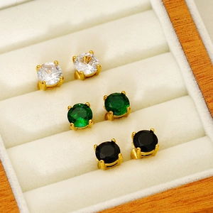 Three pairs of cubic zirconia stud earrings in white green and black with gold plating