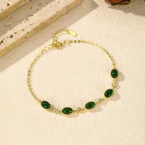 Elegant gold S925 silver bracelet with five emerald green oval stones and small diamonds