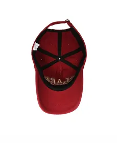 Internal structure of red cotton baseball cap showing stitching and inner label details