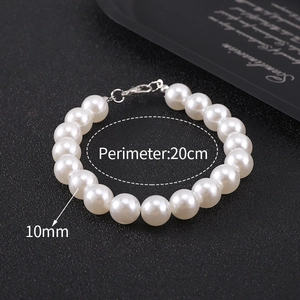 Macro detail of 10mm white pearls on a men's bracelet with 20cm perimeter size