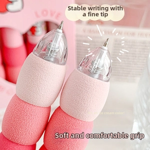 Detail of soft sponge grip and ST nib on retractable pink gradient gel pens
