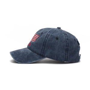 Close-up of USA embroidery and red stripes on navy blue washed denim baseball cap