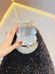 Sparkling silver spherical evening clutch bag with rhinestones and metal ring clasp