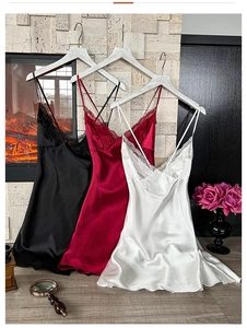 Detail of silk satin nightgown showing delicate lace trim and adjustable thin straps