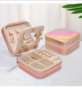 Detail of pink holographic jewelry box with zipper, mirror, and multi-functional storage slots