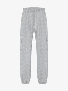 Detail of light gray men's cargo pants showing textured grid fabric and drawstring