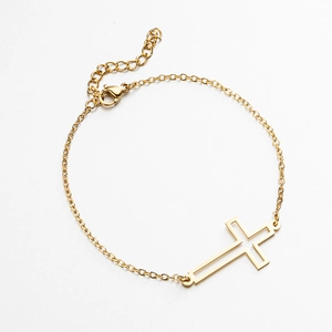 Close-up of gold cross bracelet with adjustable lobster clasp and extension chain