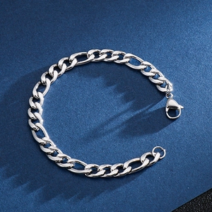 Detailed close-up showing the silver stainless steel Figaro NK chain link bracelet