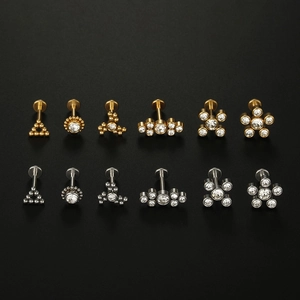 12-piece medical steel stud set with gold and silver finishes and sparkling crystals