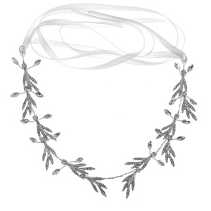 Detailed close-up of bridal headband with crystal leaves and white silk ribbon ties