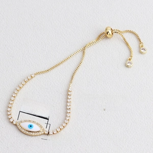 Adjustable golden Evil Eye bracelet with blue enamel and pave-set cubic zirconia stones