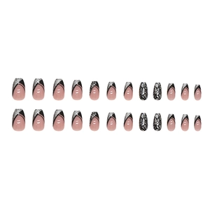 French tip press-on nails with black glitter and silver snake pattern in coffin shape