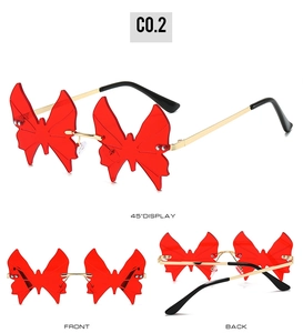 Three perspectives of frameless butterfly sunglasses with red lenses and gold metal temples