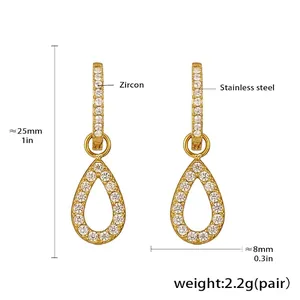 Detailed view of gold stainless steel teardrop earrings with pavé white zircon stones