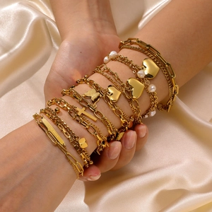 Double-layered 18K gold bracelet set with pearl charms and Good Luck rectangle plate