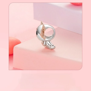 Macro shot of 925 sterling silver salamander bead with rose gold accents for DIY jewelry