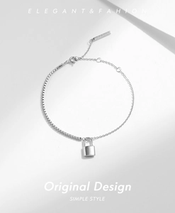 Close-up of S925 sterling silver chain bracelet with half-pave design and lock charm