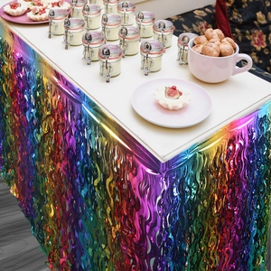 Close-up of rainbow metallic foil fringe table skirt for festive party decorations
