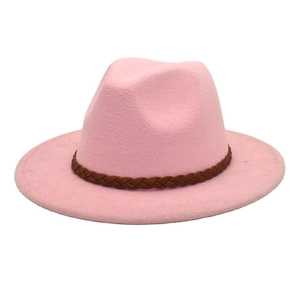 Detail of pink wool fedora hat featuring a brown braided decorative belt on the brim